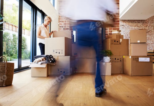 Preview: Its never too late to relocate. Shot of a mature couple unpacking boxes on moving day.