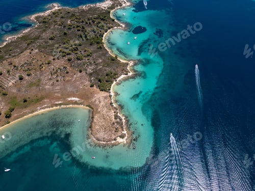Preview: Aerial view of a scenic Mediterranean peninsula with turquoise water, boats, and small beaches. Beau