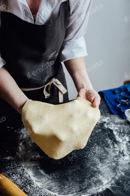 Preview: Person rolling homemade cookie dough