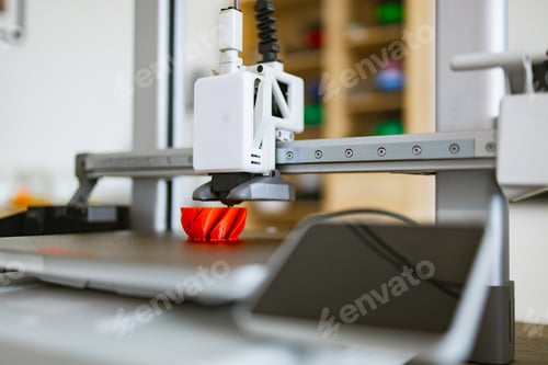 3D Printer Creating a Red Object