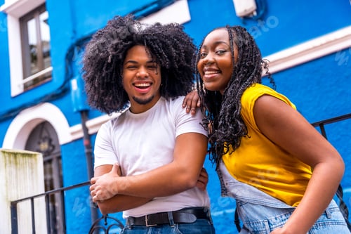 Preview: Happy african stylish couple smiling at camera outdoors
