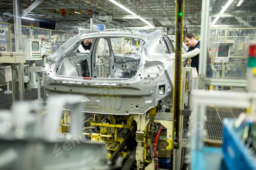 Preview: Two colleagues working in modern car factory