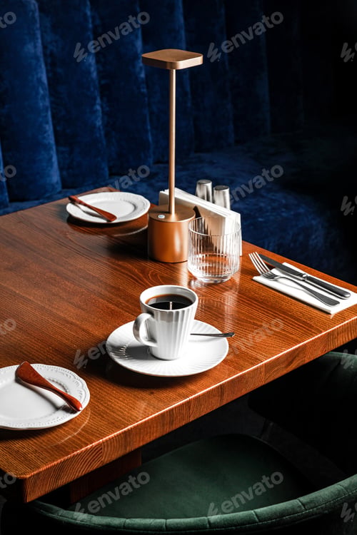 Preview: A cup of black coffee on the table in a restaurant