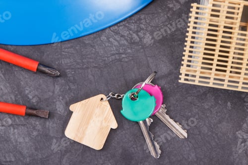 Preview: House under construction, keys and work tools for engineering work. Building home concept