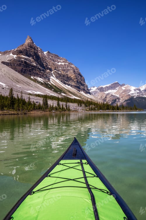 Preview: Kayaking in a glacier lake during a vibrant sunny summer day