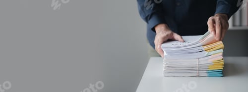 Preview: Businessman sorting stacks of department meeting papers, document management in corporate office. Of