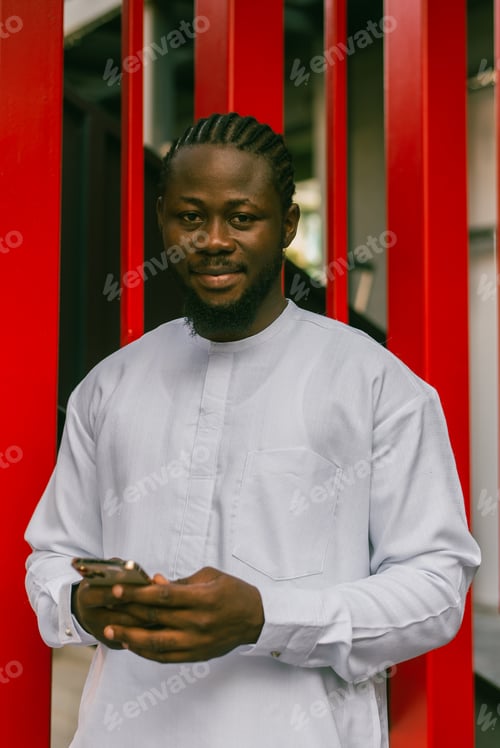 Preview: Cheerful male tourist portrait dress in white wear dashiki ethnic smiling at city street or small