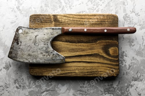 Preview: Old rustic axe for meat on a wooden board