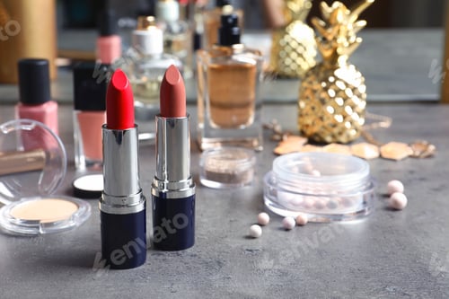 Preview: Bright lipsticks on dressing table. Decorative cosmetics