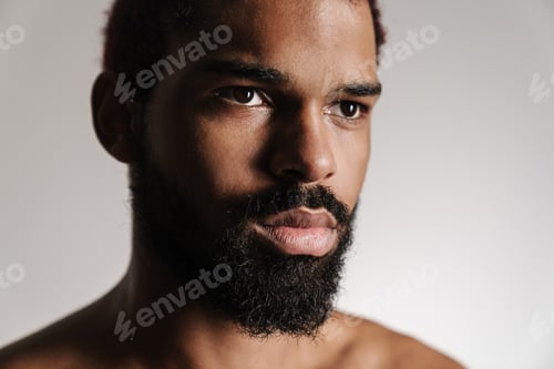 Preview: Black shirtless bearded man posing and looking aside