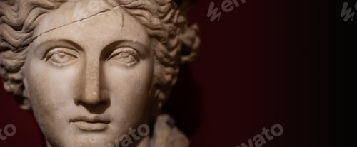 Preview: closeup of woman antique statue face on dark background