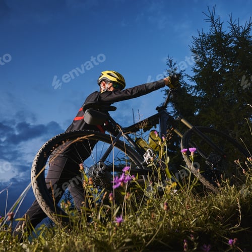 Preview: Young man riding a mountain bike downhill style