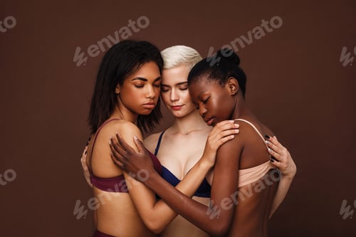Preview: Group of beautiful young women hugging together in their underwear