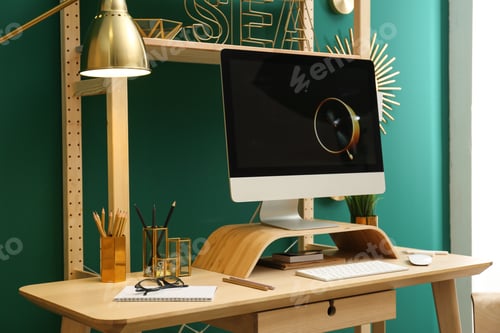 Preview: Stylish room interior with modern workplace at color wall