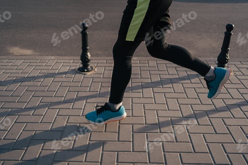 Preview: Fit man running legs in the city
