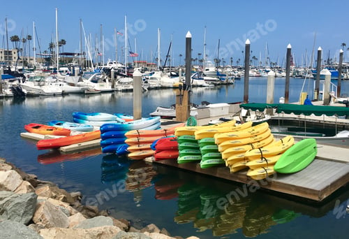 Preview: Colorful kayaks lined up on dock in Oceanside harbor