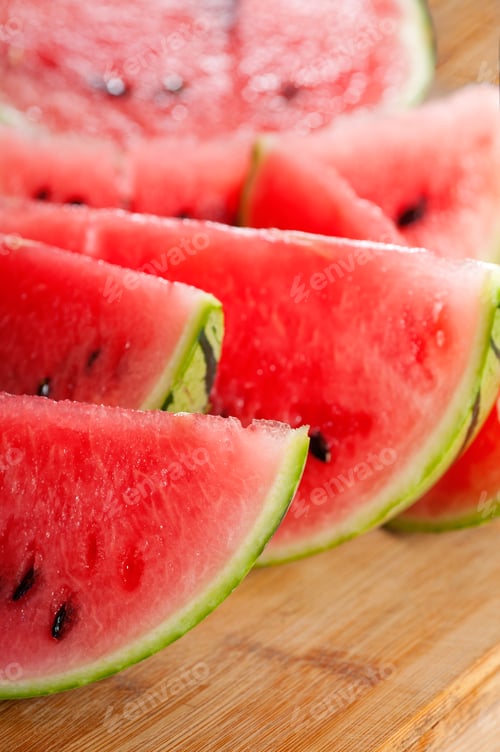 Preview: fresh watermelon on a wood table