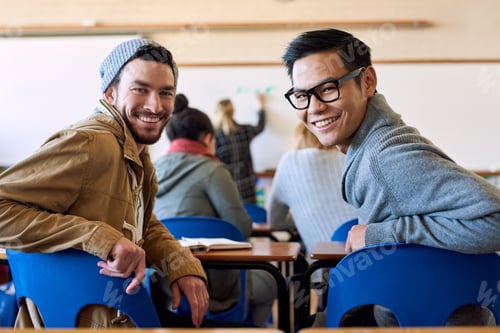 Preview: Rearview portrait of two young male university students sitting in class during a lecture