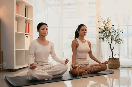 Preview: Peaceful mother and daughter practice mindfulness and meditation together