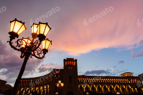 Preview: Street lamp and historic building at sunset in Yerevan