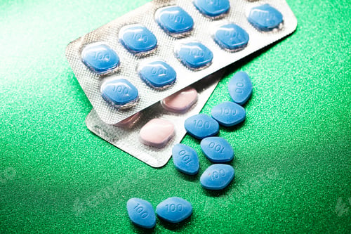 Preview: Pill for men's health and Valentine's Day background.