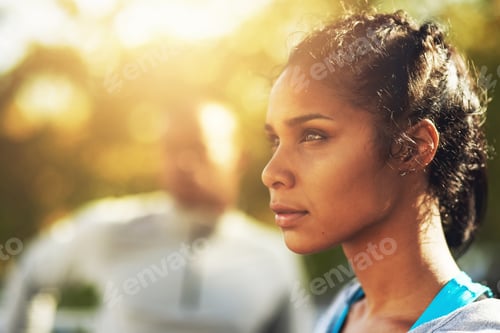 Preview: Focused on staying in form. Shot of a young sporty couple out for a workout.