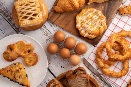 Preview: Various breads and eggs on red white cloth. Selective focus.