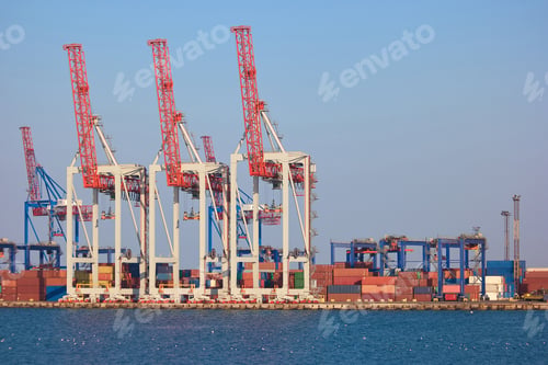 Preview: Cranes and containers in sea port.