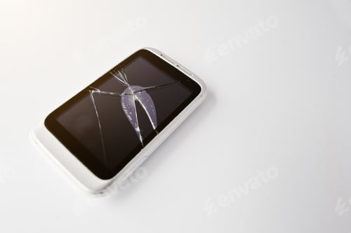 Preview: Broken screen of smart phone at white background