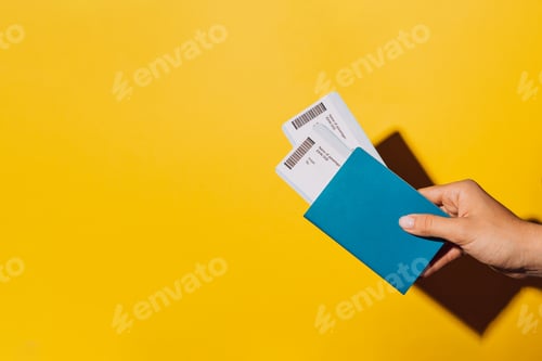 Preview: Two tickets in the passport against yellow background