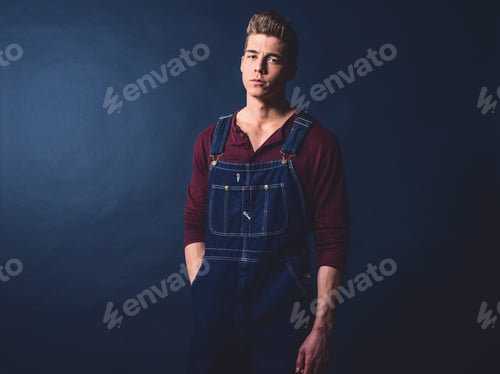 Preview: Retro 1950S Worker Fashion Man Wearing Jeans Bib And Brace.
