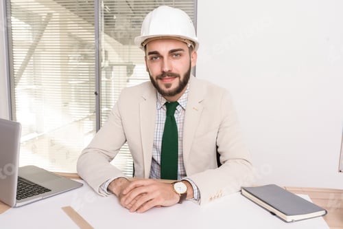 Architectural Professional Wearing Hard Hat in Office