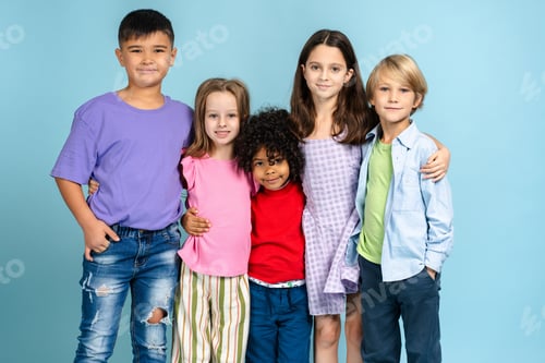 Preview: Group of smiling multinational kids, happy boys and girls hugging together