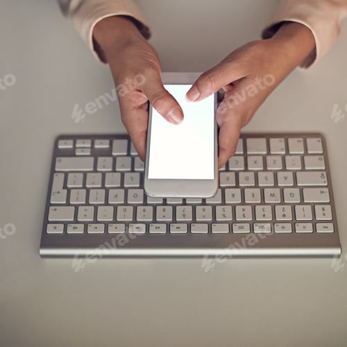 Preview: High angle shot of an unrecognizable businesswoman using a mobile phone