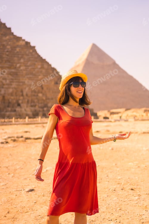 Preview: Portrait Of A Young Girl In Red Dress At The Pyramid Of Cheops The Largest Pyramid. The Pyramids Of