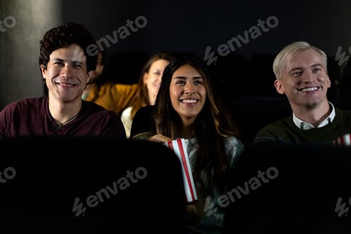 Preview: Friends watching and enjoying a movie at the cinema