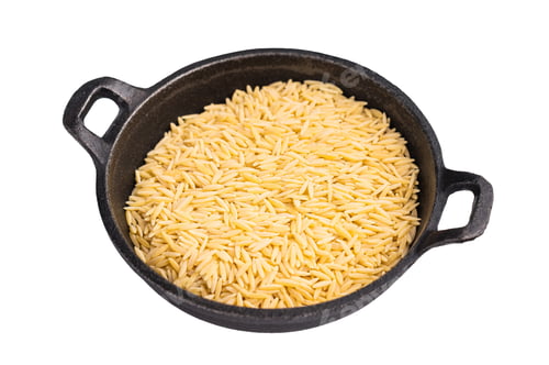 Preview: Raw Orzo pasta, uncooked dry Italian risoni in a bowl isolated on white background. top view