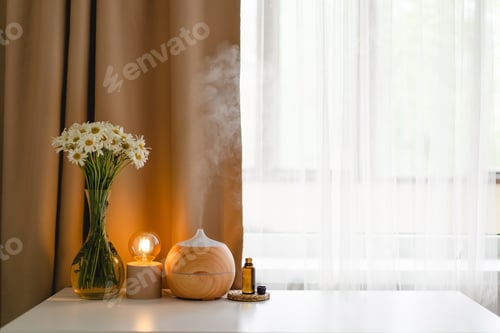 Preview: Aromatherapy concept. Aroma oil diffuser on the table against the window.