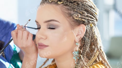 Preview: caucasian model false eyelashes during make-up session.. The model has white, clean complexion.