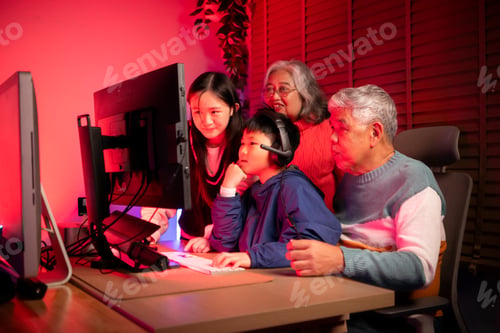 Preview: Happy grandparents playing games with grandchildren in in a neon lit room