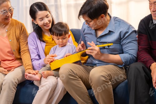 Preview: A happy ASEAN family living together as a big family is together in the living room at home