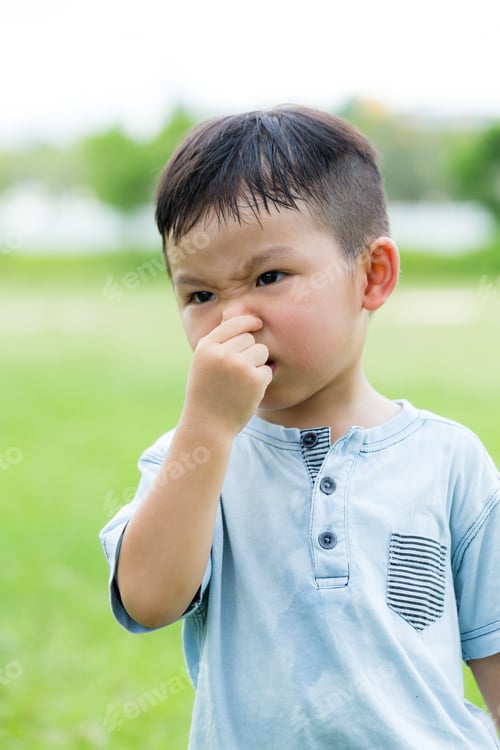 Preview: Asian little kid feeling itchy on his nose