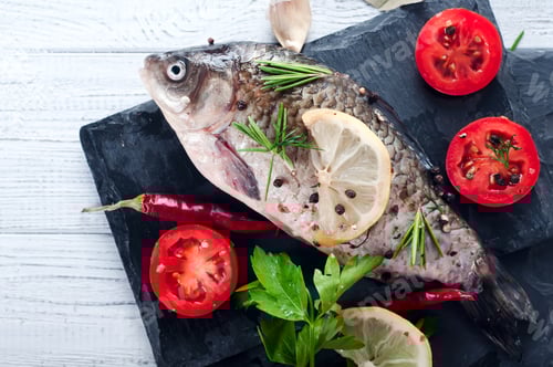 Preview: Delicious fresh fish on white vintage background.