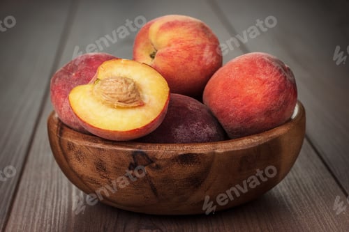 Preview: Wooden Bowl With Some Peaches On The Table