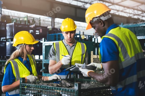 Preview: Group of Diverse Warehouse Workers Working Together to Quality Control in Factory.