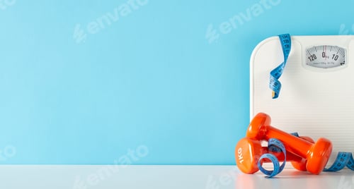 Preview: Promoting a healthy lifestyle. Top view of a table containing a scale, measuring tape
