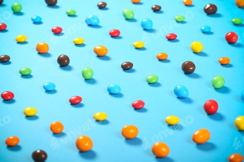 Preview: Candy Drops Of Different Colors Lie On A Bright Background