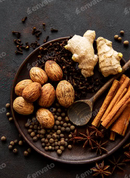 Preview: Assorted Spices and Ginger on Wooden Plate