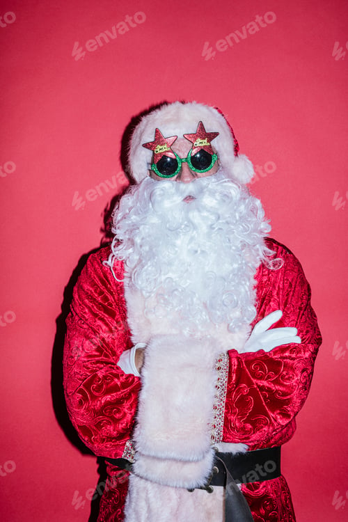 Preview: Man dressed as Santa Claus gesturing with funny glasses
