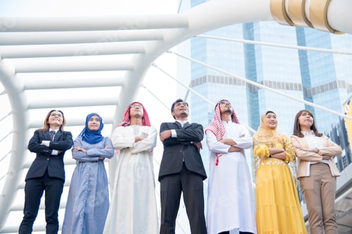 Preview: Multiethnic group of young collaboration team standing hands together